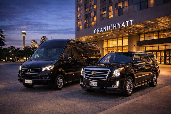 Executive chauffeur vehicles outside the Grand Hyatt San Antonio River Walk for NBAA Leadership Conference 2026